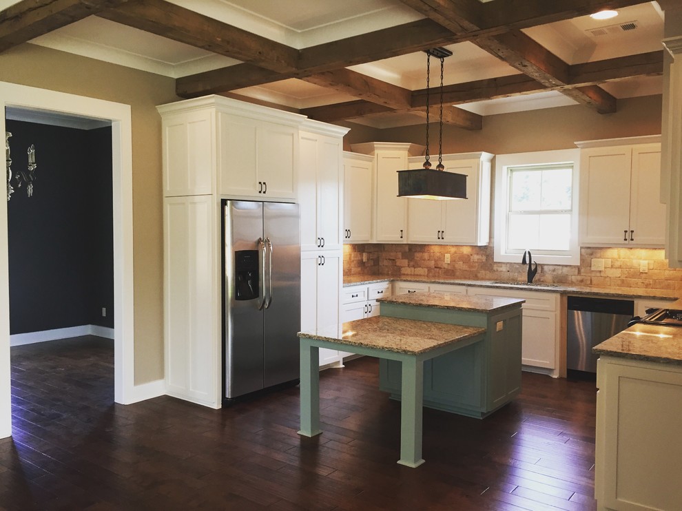 Mid-sized mountain style u-shaped medium tone wood floor kitchen photo in New Orleans with an undermount sink, recessed-panel cabinets, white cabinets, granite countertops, stainless steel appliances and an island