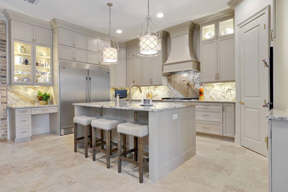 Open concept kitchen - large transitional u-shaped travertine floor and beige floor open concept kitchen idea in New Orleans with an undermount sink, recessed-panel cabinets, beige cabinets, granite countertops, beige backsplash, marble backsplash, stainless steel appliances and an island