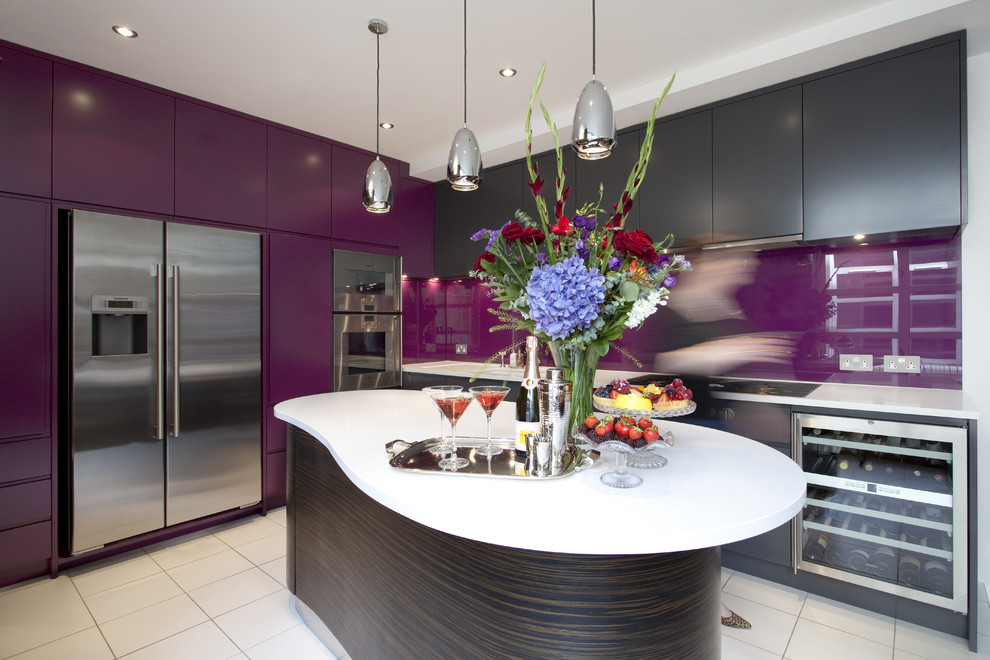 Trendy kitchen photo in London with stainless steel appliances
