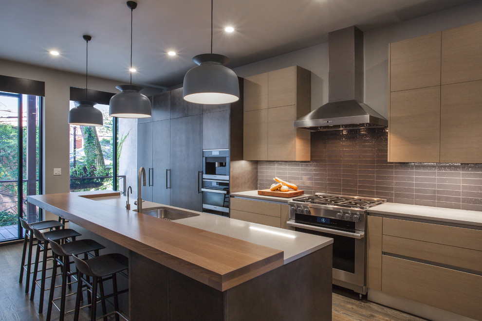 Large trendy l-shaped dark wood floor and brown floor open concept kitchen photo in Chicago with an undermount sink, flat-panel cabinets, gray cabinets, quartz countertops, gray backsplash, ceramic backsplash, stainless steel appliances, an island and gray countertops
