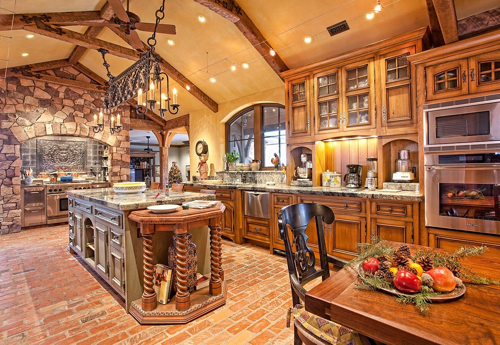 Large arts and crafts galley brick floor and orange floor eat-in kitchen photo in Other with an undermount sink, recessed-panel cabinets, medium tone wood cabinets, granite countertops, beige backsplash, stone slab backsplash, stainless steel appliances, an island and beige countertops
