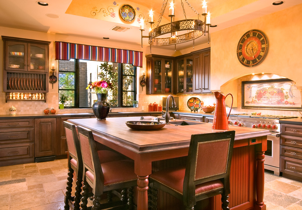 Tuscan kitchen photo in Phoenix with an undermount sink, recessed-panel cabinets, dark wood cabinets, wood countertops and beige backsplash