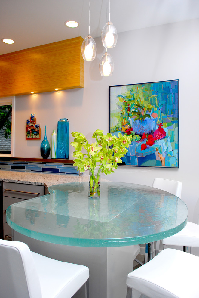 Inspiration for a contemporary kitchen remodel in Austin with glass countertops and turquoise countertops