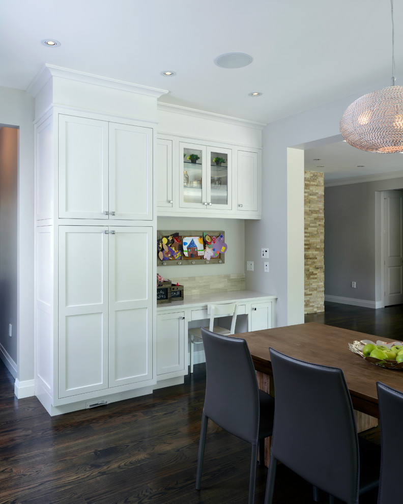 Traditional kitchen/diner in Toronto with shaker cabinets and white cabinets.