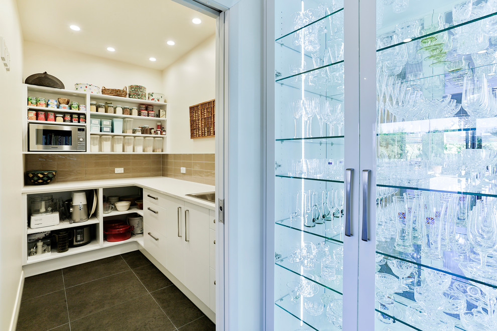 On Display dark timber and glass shelves in modern kitchen