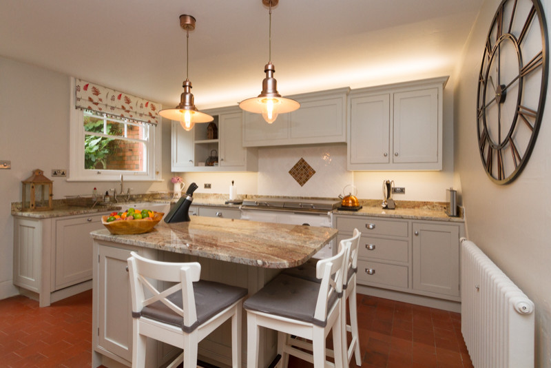 Design ideas for a large l-shaped kitchen/diner in Gloucestershire with a double-bowl sink, shaker cabinets, grey cabinets, granite worktops, white splashback, ceramic splashback, integrated appliances, terracotta flooring, an island, red floors and brown worktops.