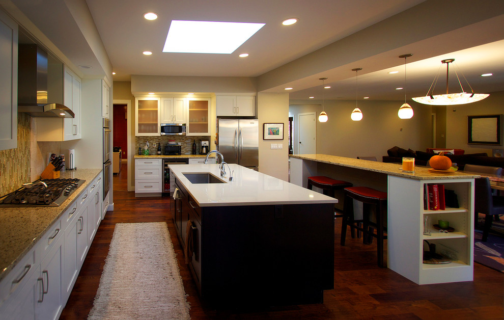 This is an example of a medium sized contemporary kitchen/diner in Bridgeport with shaker cabinets and multiple islands.