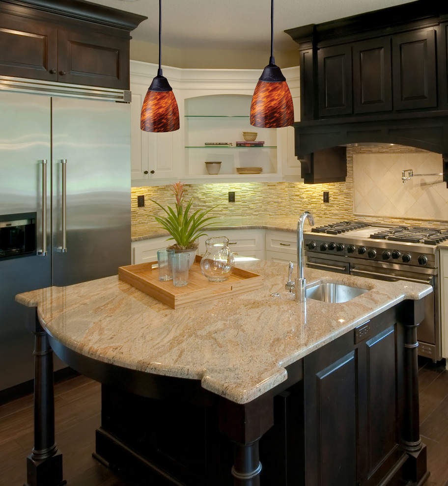 Example of a mid-sized trendy u-shaped medium tone wood floor enclosed kitchen design in New York with an undermount sink, shaker cabinets, medium tone wood cabinets, granite countertops, beige backsplash, porcelain backsplash, stainless steel appliances and an island