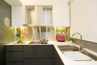 Custom, in-cabinet dish drying rack. Water drips directly into the sink. -  Transitional - Kitchen - Seattle - by Genay Bell Interior Design