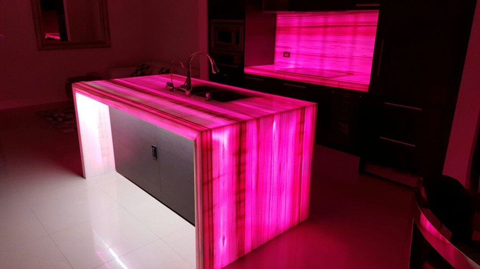 Kitchen - modern kitchen idea in Miami with onyx countertops