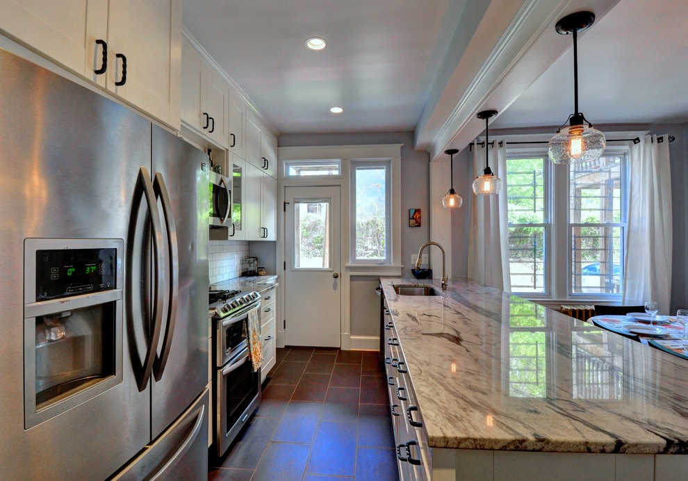 Eat-in kitchen - mid-sized eclectic galley porcelain tile eat-in kitchen idea in DC Metro with an undermount sink, shaker cabinets, white cabinets, quartzite countertops, white backsplash, subway tile backsplash, stainless steel appliances and a peninsula