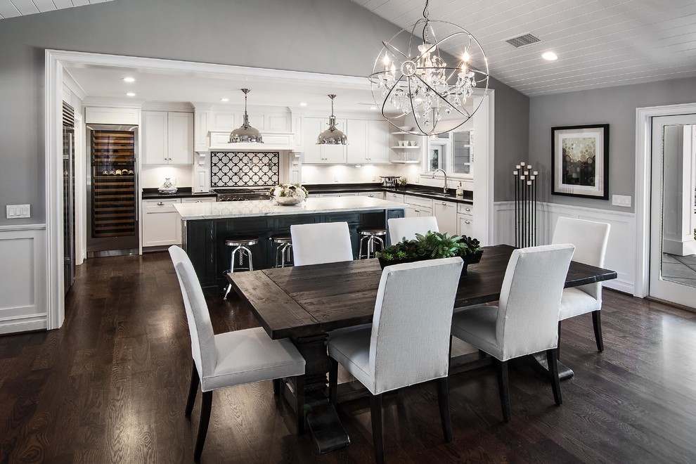 Mid-sized eclectic single-wall dark wood floor eat-in kitchen photo in Dallas with a single-bowl sink, shaker cabinets, white cabinets, marble countertops, white backsplash, mosaic tile backsplash, stainless steel appliances and an island