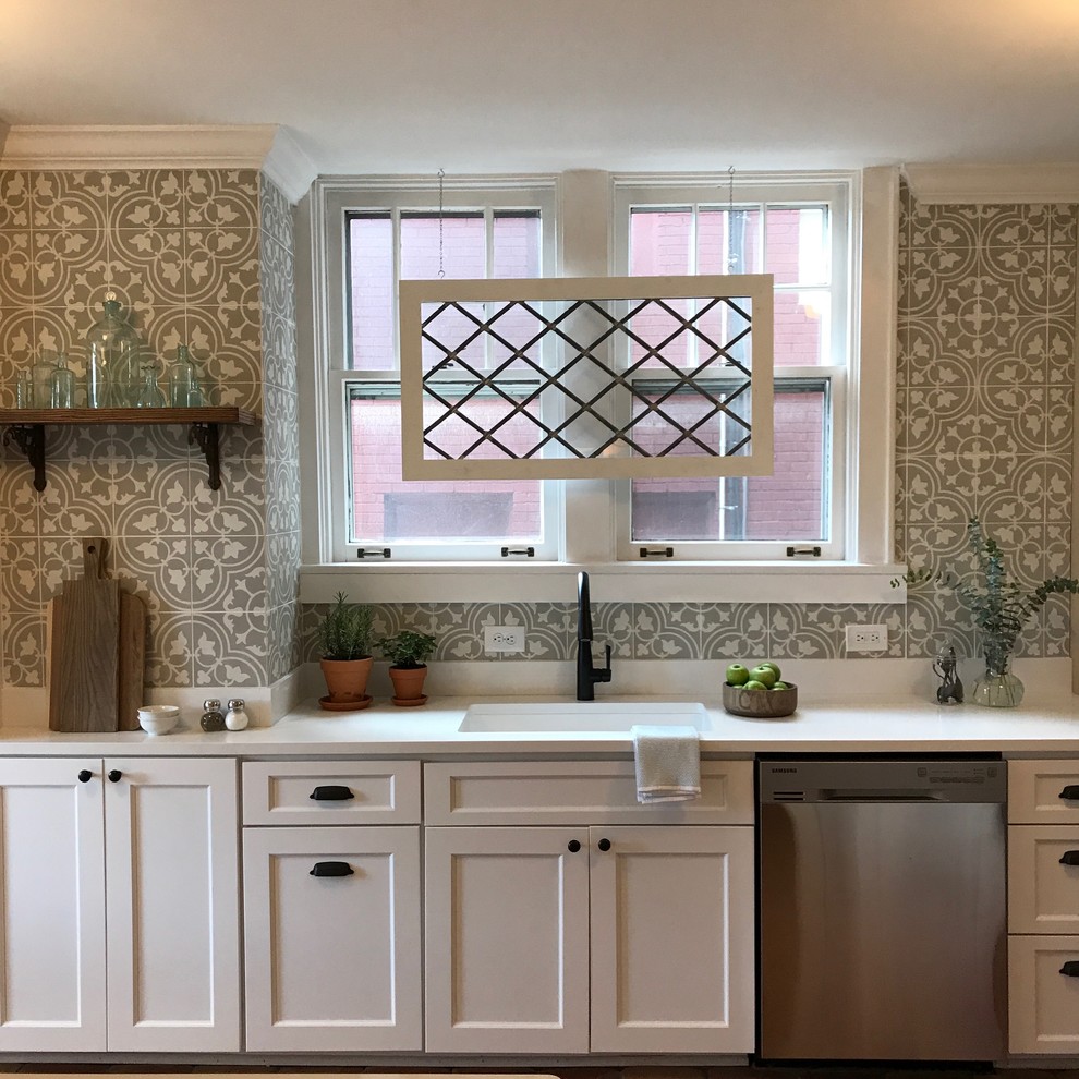 Small arts and crafts galley terra-cotta tile kitchen photo in Baltimore with an undermount sink, shaker cabinets, white cabinets, granite countertops, cement tile backsplash, stainless steel appliances and a peninsula