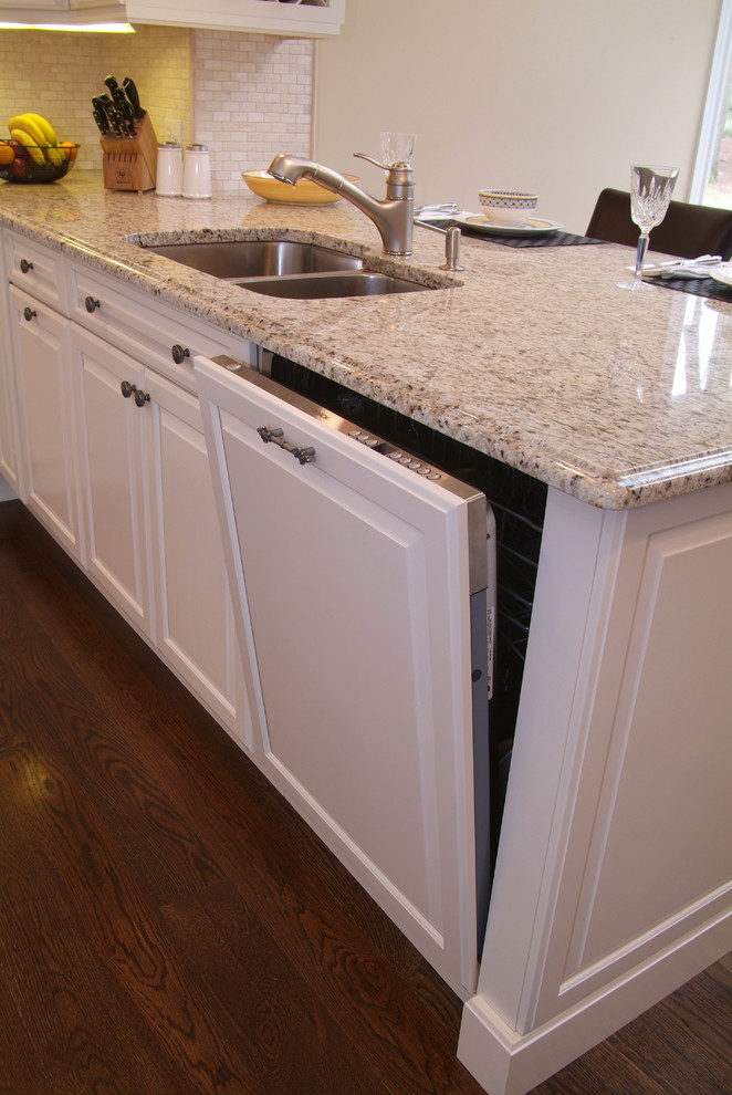 Eat-in kitchen - mid-sized contemporary u-shaped dark wood floor eat-in kitchen idea in Boston with a double-bowl sink, beaded inset cabinets, white cabinets, granite countertops, beige backsplash, mosaic tile backsplash, stainless steel appliances and a peninsula