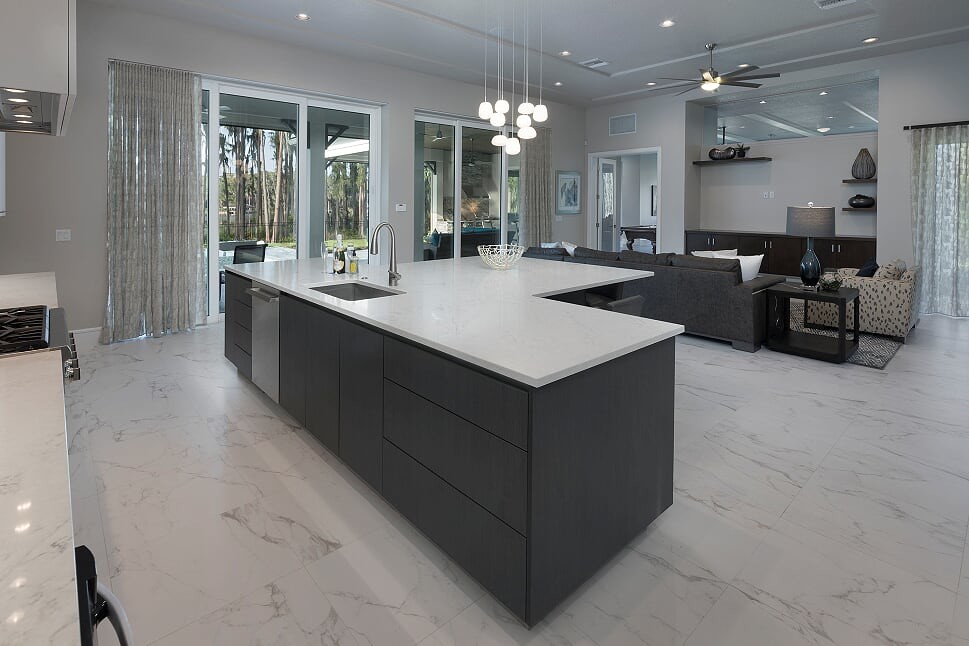 Inspiration for a large contemporary l-shaped marble floor and white floor open concept kitchen remodel in Orlando with an undermount sink, dark wood cabinets, marble countertops, stainless steel appliances, an island and white countertops