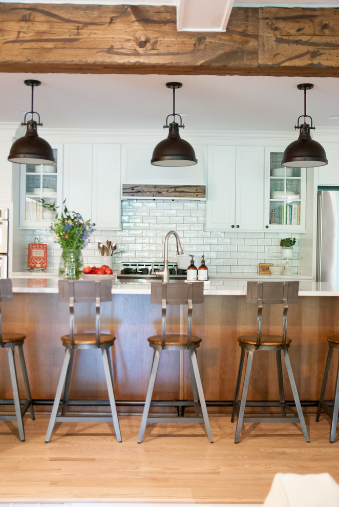 Open concept kitchen - cottage open concept kitchen idea in Houston with shaker cabinets and an island