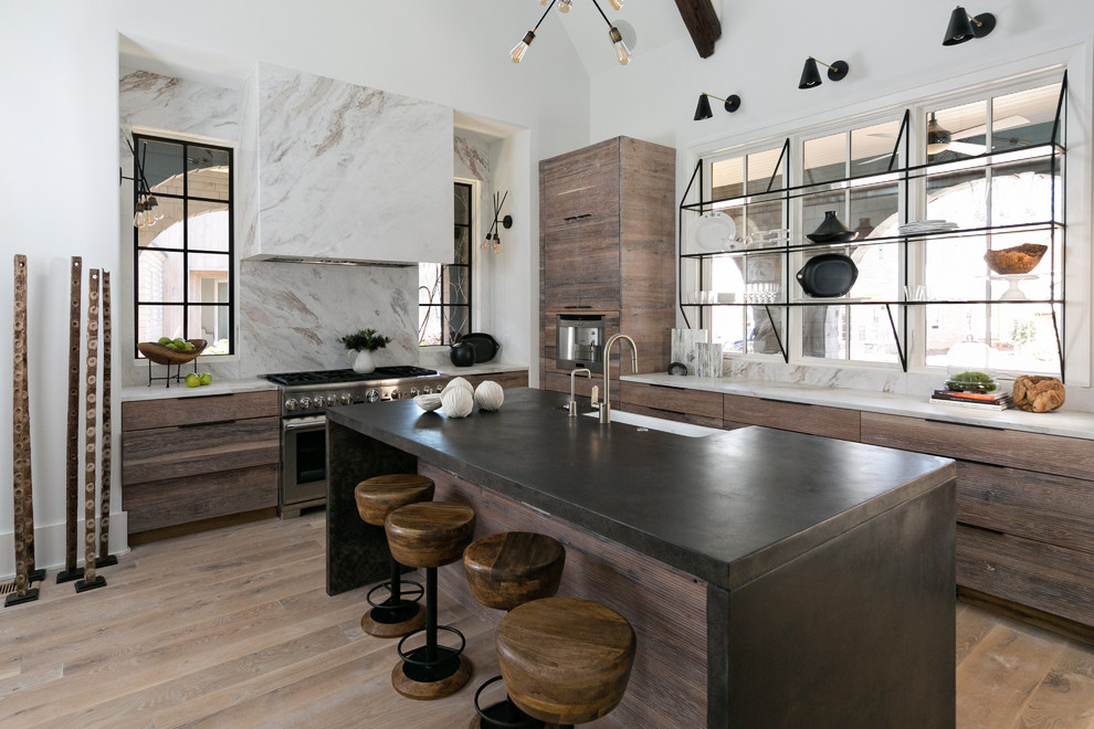 Inspiration for a contemporary l-shaped kitchen in Atlanta with a belfast sink, flat-panel cabinets, dark wood cabinets, stainless steel appliances, medium hardwood flooring, an island, marble worktops, white splashback, marble splashback and grey floors.