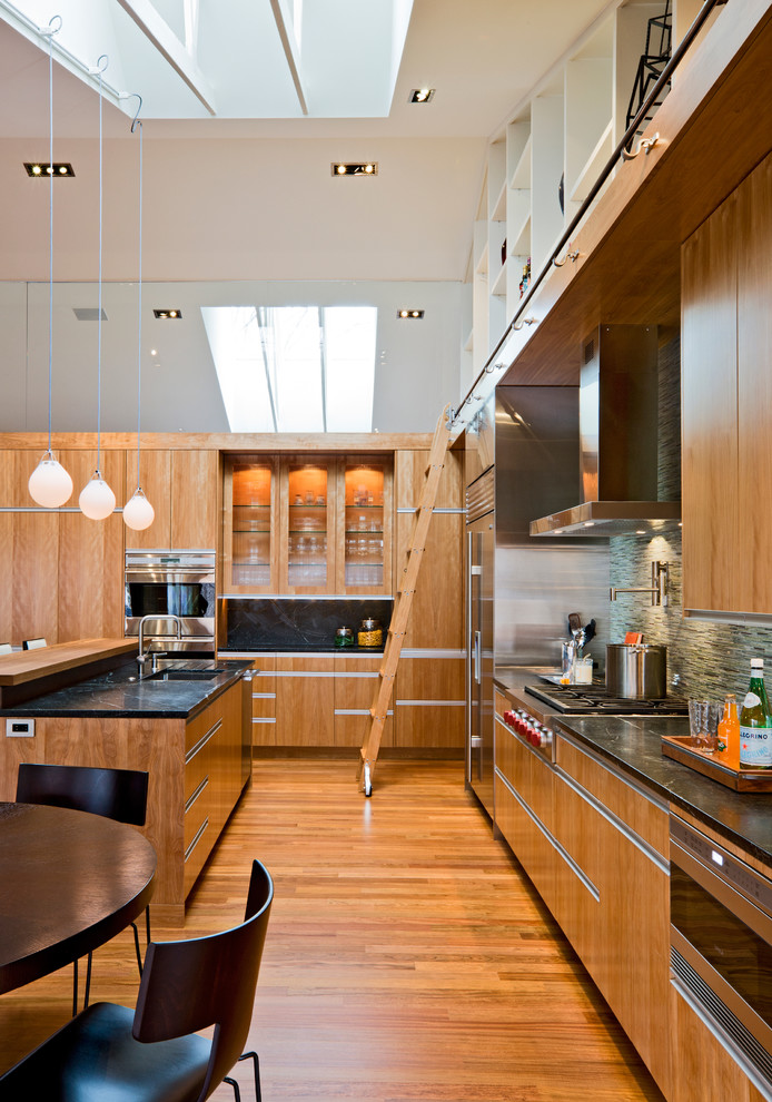 Design ideas for a modern kitchen in Minneapolis with flat-panel cabinets and integrated appliances.