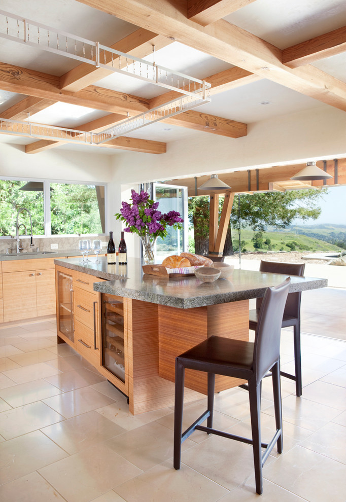 Contemporary kitchen in San Francisco with flat-panel cabinets, light wood cabinets and beige floors.