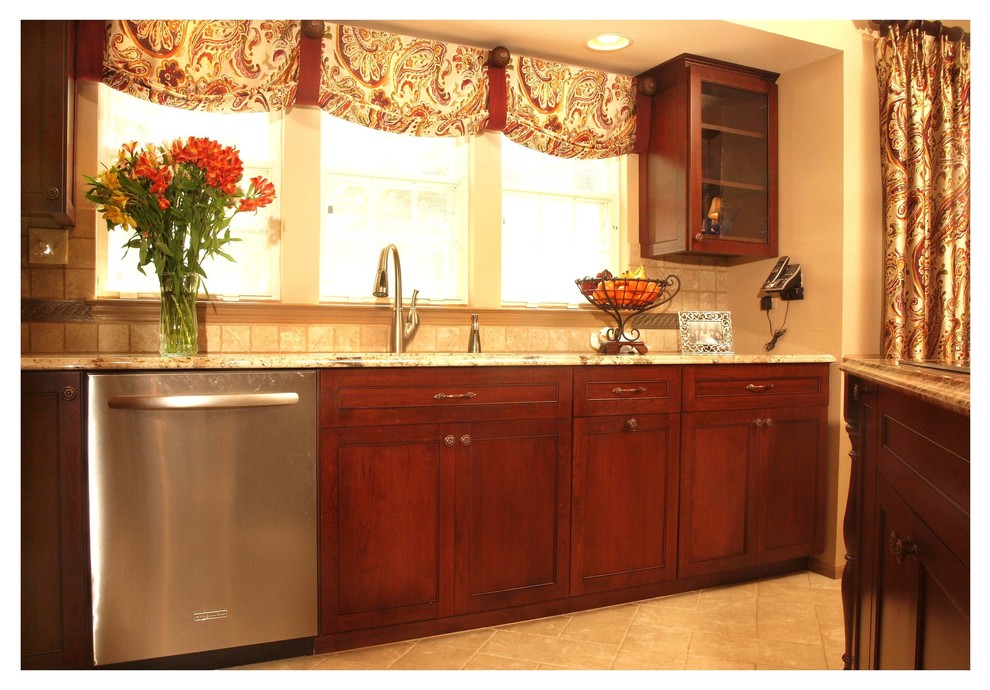 Ornate Cherry Wood Farmhouse Kitchen with Traditional Details in