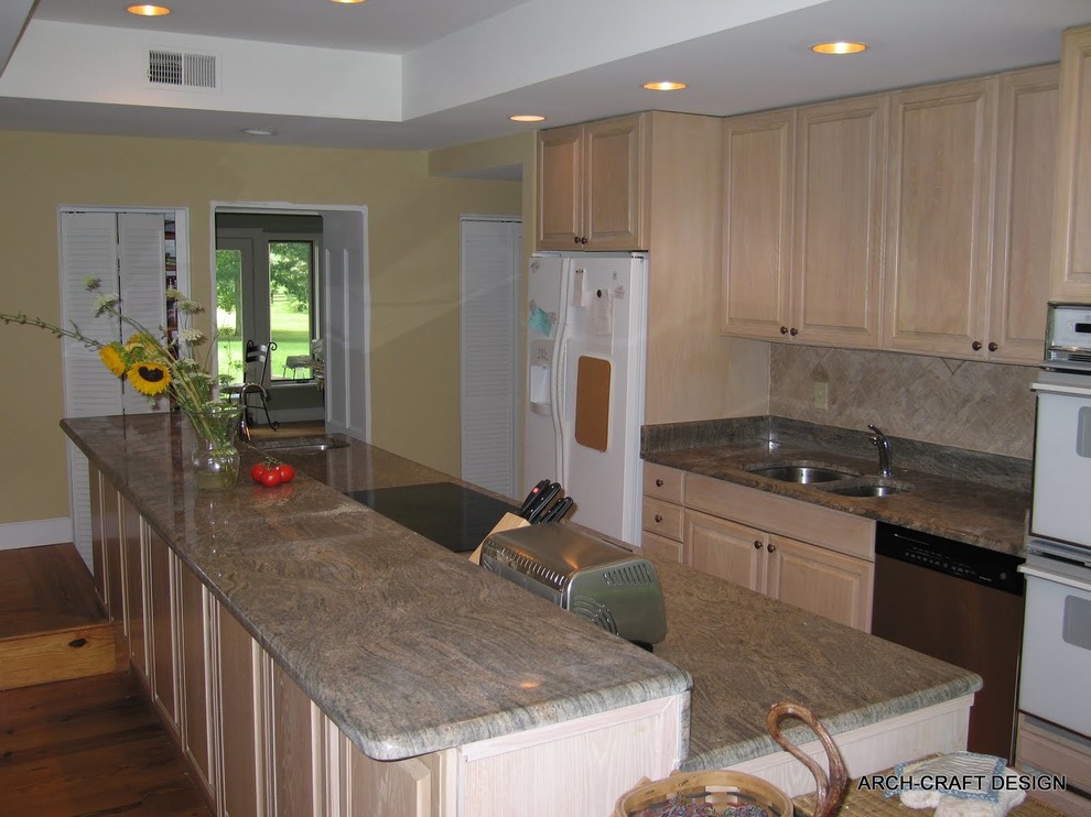 Example of a mid-sized minimalist single-wall medium tone wood floor eat-in kitchen design in DC Metro with an undermount sink, raised-panel cabinets, light wood cabinets, granite countertops, beige backsplash, stone slab backsplash, white appliances and an island