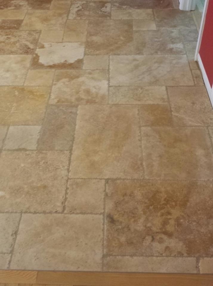 This is an example of a medium sized traditional kitchen in Chicago with travertine flooring.