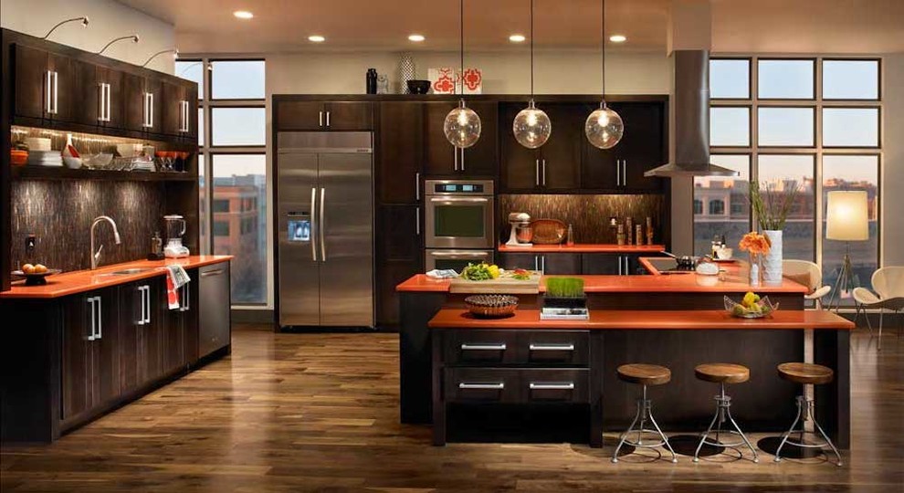 Design ideas for a large contemporary single-wall kitchen/diner in Denver with a submerged sink, flat-panel cabinets, dark wood cabinets, composite countertops, multi-coloured splashback, matchstick tiled splashback, stainless steel appliances, dark hardwood flooring, an island and brown floors.