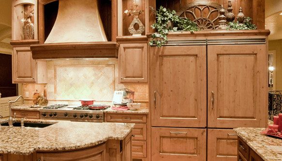Open concept kitchen - mid-sized traditional open concept kitchen idea in DC Metro with an undermount sink, raised-panel cabinets, light wood cabinets, granite countertops, beige backsplash, ceramic backsplash, stainless steel appliances and an island