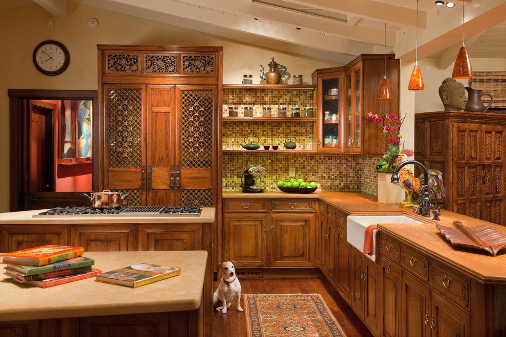 Large u-shaped eat-in kitchen photo in San Diego with dark wood cabinets, green backsplash and an island