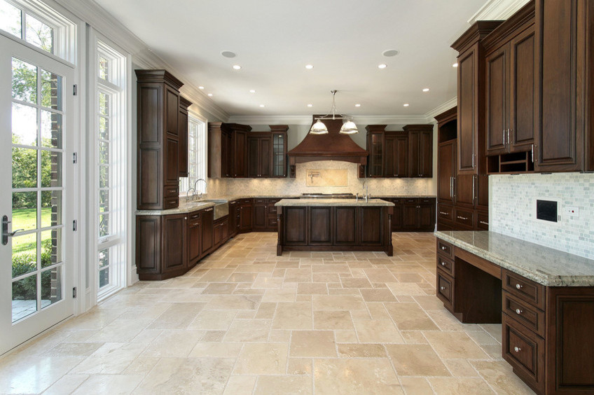 Inspiration for an u-shaped ceramic tile kitchen remodel in Houston with medium tone wood cabinets, granite countertops, stainless steel appliances and an island