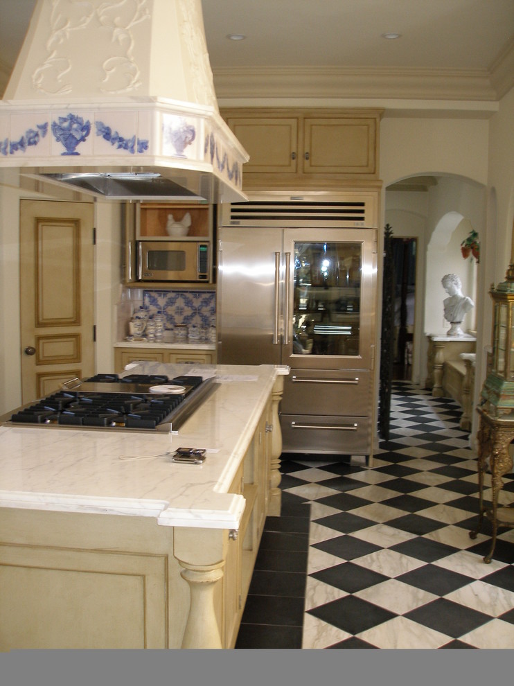 Mid-sized elegant u-shaped ceramic tile enclosed kitchen photo in San Diego with shaker cabinets, beige cabinets, marble countertops, blue backsplash, ceramic backsplash, stainless steel appliances, an island and a double-bowl sink
