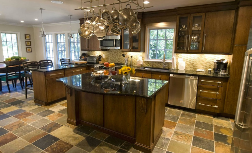 Example of a mid-sized classic l-shaped eat-in kitchen design in New York with an undermount sink, flat-panel cabinets, medium tone wood cabinets, granite countertops, stainless steel appliances and an island
