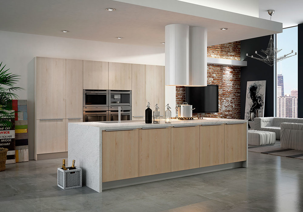 Bild på ett funkis linjärt kök och matrum, med en undermonterad diskho, luckor med glaspanel, vita skåp, bänkskiva i rostfritt stål, rostfria vitvaror, betonggolv, en köksö och grått golv