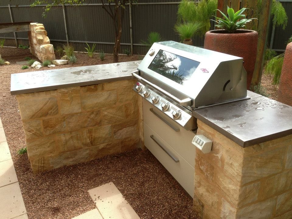 Outdoor Kitchen polished concrete benchtop with sandstone clad base