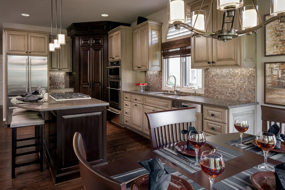 Design ideas for a large classic kitchen in Kansas City with a submerged sink, grey cabinets, engineered stone countertops, metallic splashback, mosaic tiled splashback, stainless steel appliances, dark hardwood flooring and an island.