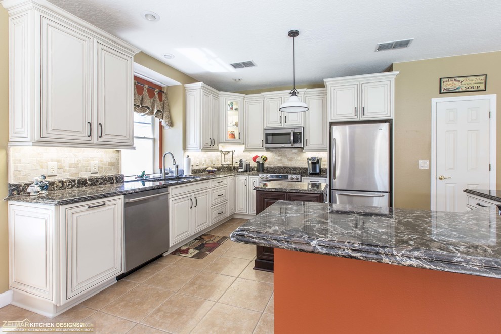 Mid-sized elegant kitchen photo in Orlando with recessed-panel cabinets and beige cabinets