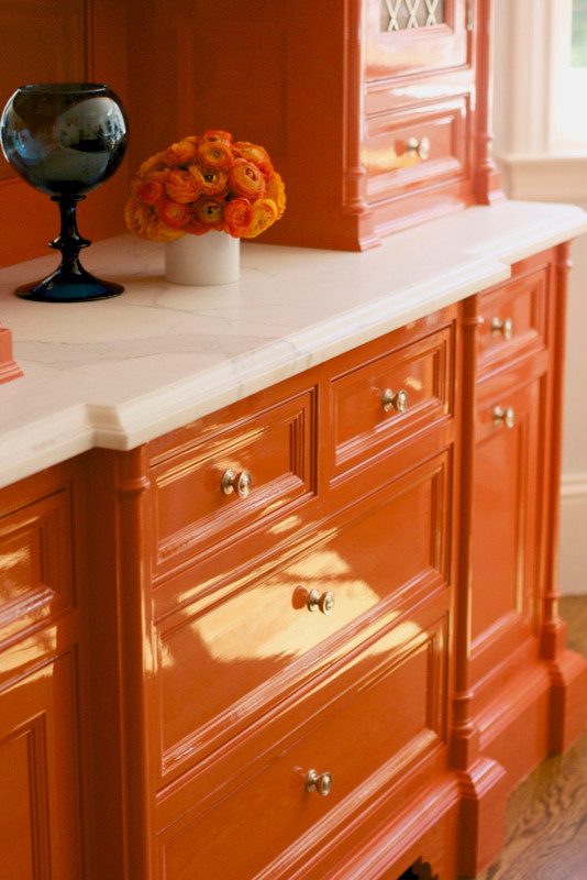Inspiration for a transitional eat-in kitchen remodel in San Francisco with orange cabinets and marble countertops