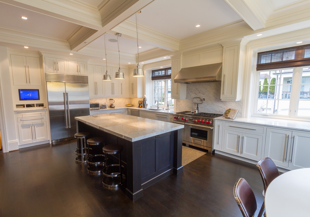 Inspiration for a timeless l-shaped dark wood floor eat-in kitchen remodel in Other with shaker cabinets, white cabinets, white backsplash, stainless steel appliances, a double-bowl sink, marble countertops, stone slab backsplash and an island