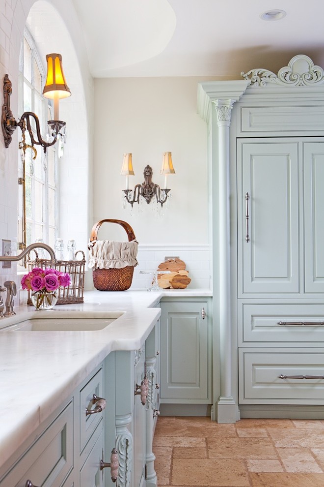 Inspiration for a mid-sized shabby-chic style u-shaped ceramic tile enclosed kitchen remodel in St Louis with an undermount sink, raised-panel cabinets, green cabinets, white backsplash, subway tile backsplash, paneled appliances and wood countertops