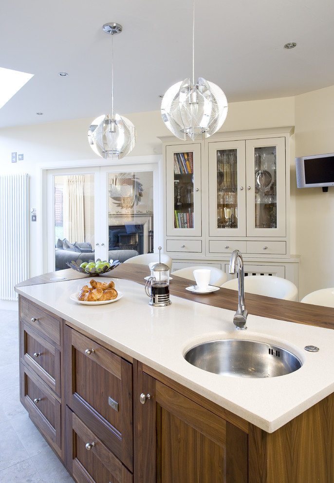 Inspiration for a transitional enclosed kitchen remodel in Dublin with shaker cabinets and dark wood cabinets
