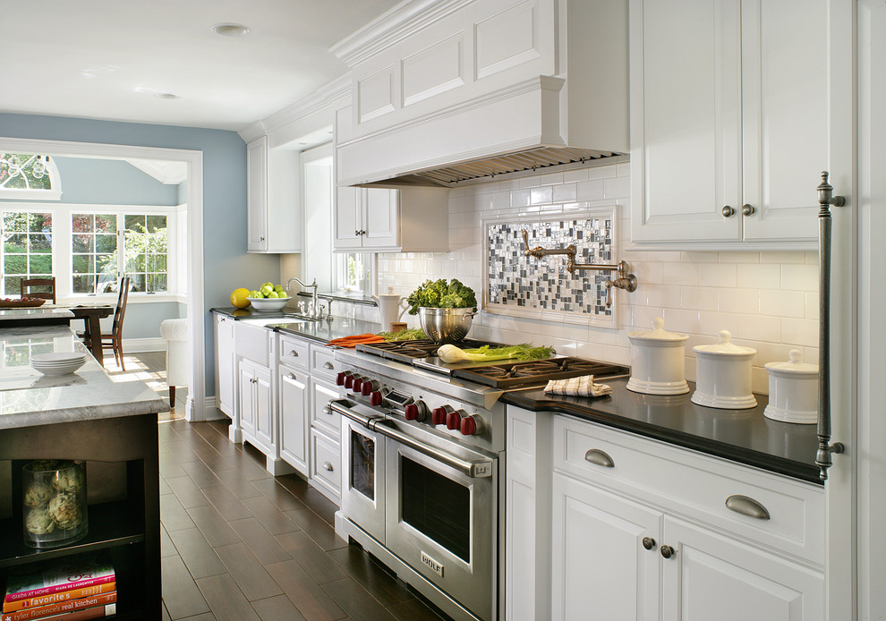 Kitchen - contemporary kitchen idea in Huntington with subway tile backsplash
