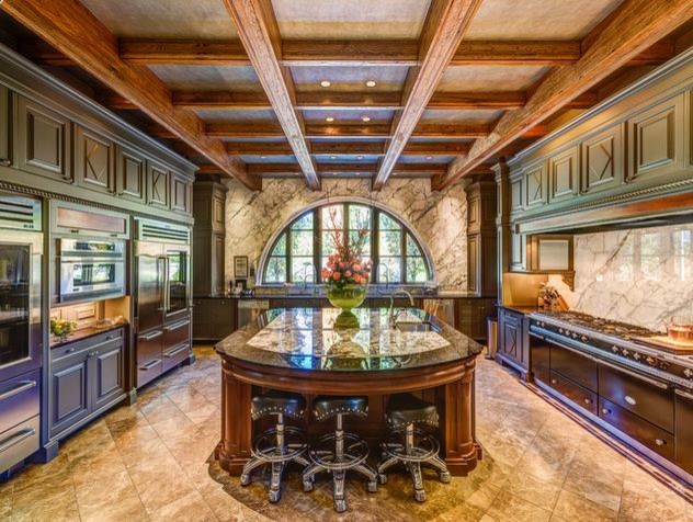 Inspiration for a large timeless u-shaped marble floor eat-in kitchen remodel in Nashville with an undermount sink, recessed-panel cabinets, green cabinets, granite countertops, multicolored backsplash, stone slab backsplash, stainless steel appliances and an island