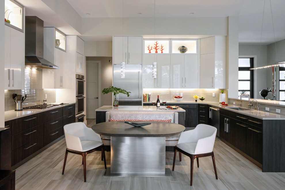 Large trendy u-shaped eat-in kitchen photo in Miami with an undermount sink, dark wood cabinets, stainless steel appliances and two islands