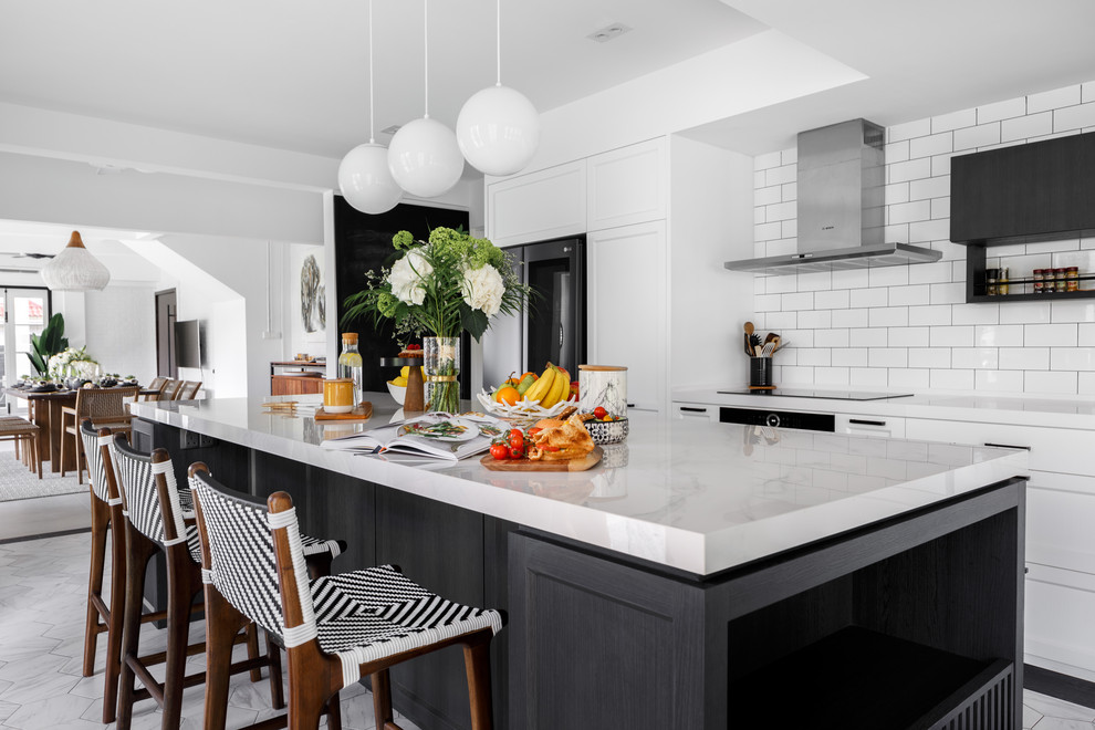 Trendy galley white floor kitchen photo in Singapore with recessed-panel cabinets, white cabinets, white backsplash, subway tile backsplash, black appliances and an island