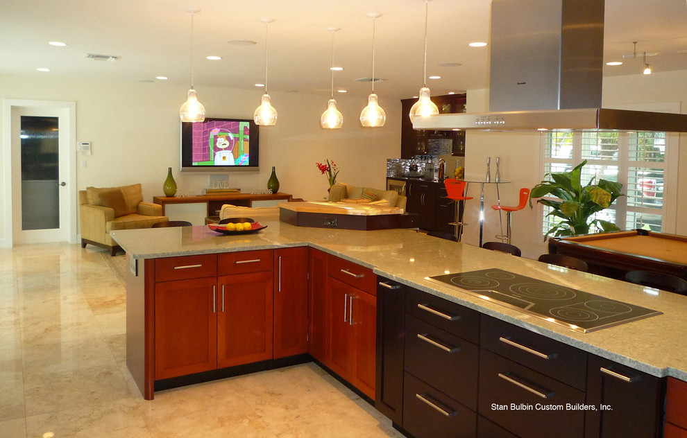 Open concept kitchen - mid-sized contemporary single-wall limestone floor and beige floor open concept kitchen idea in Miami with an undermount sink, shaker cabinets, dark wood cabinets, quartz countertops, white backsplash, stainless steel appliances and an island