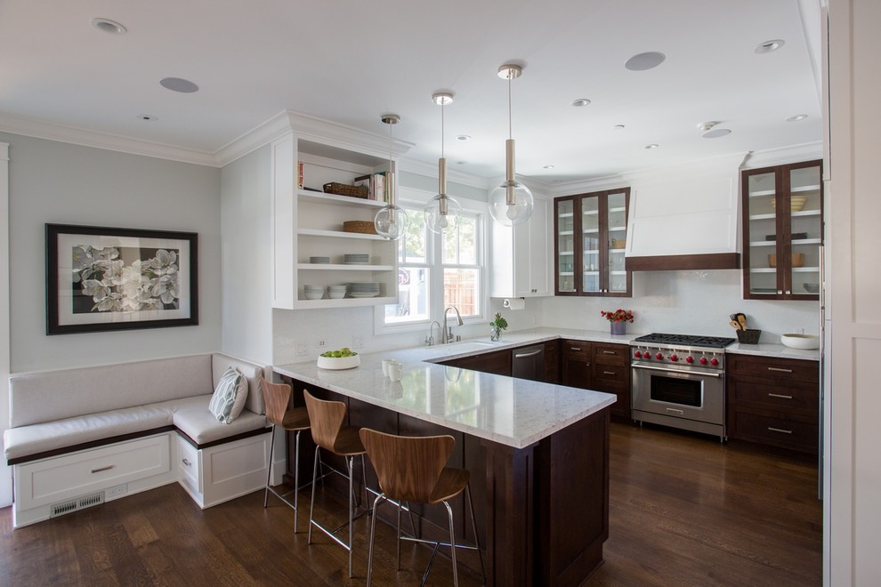 Example of a mid-sized transitional u-shaped dark wood floor open concept kitchen design in San Francisco with an undermount sink, shaker cabinets, dark wood cabinets, quartz countertops, white backsplash, glass tile backsplash, paneled appliances and a peninsula