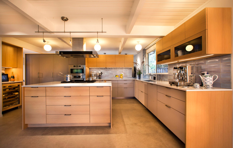 Design ideas for a midcentury u-shaped kitchen in San Francisco with flat-panel cabinets, light wood cabinets and grey splashback.