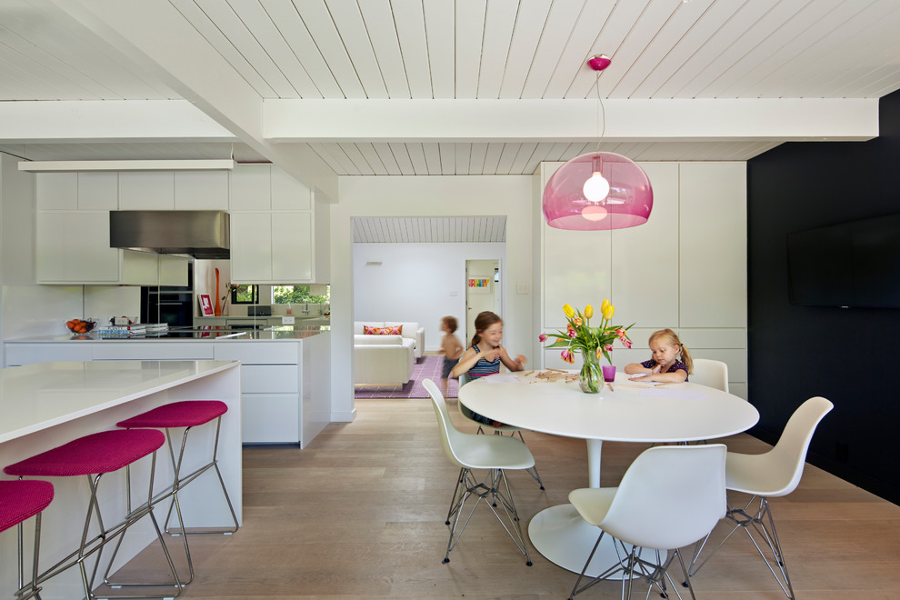 Example of a 1950s kitchen design in San Francisco with flat-panel cabinets and white cabinets