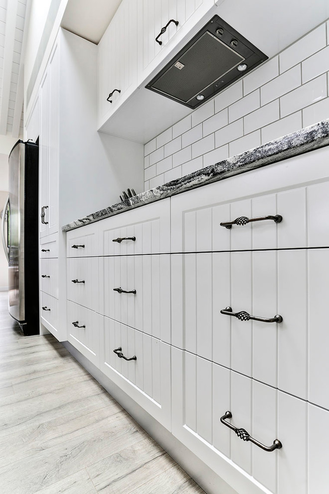 Panelled cupboard doors and twisted handles Country Kitchen Other