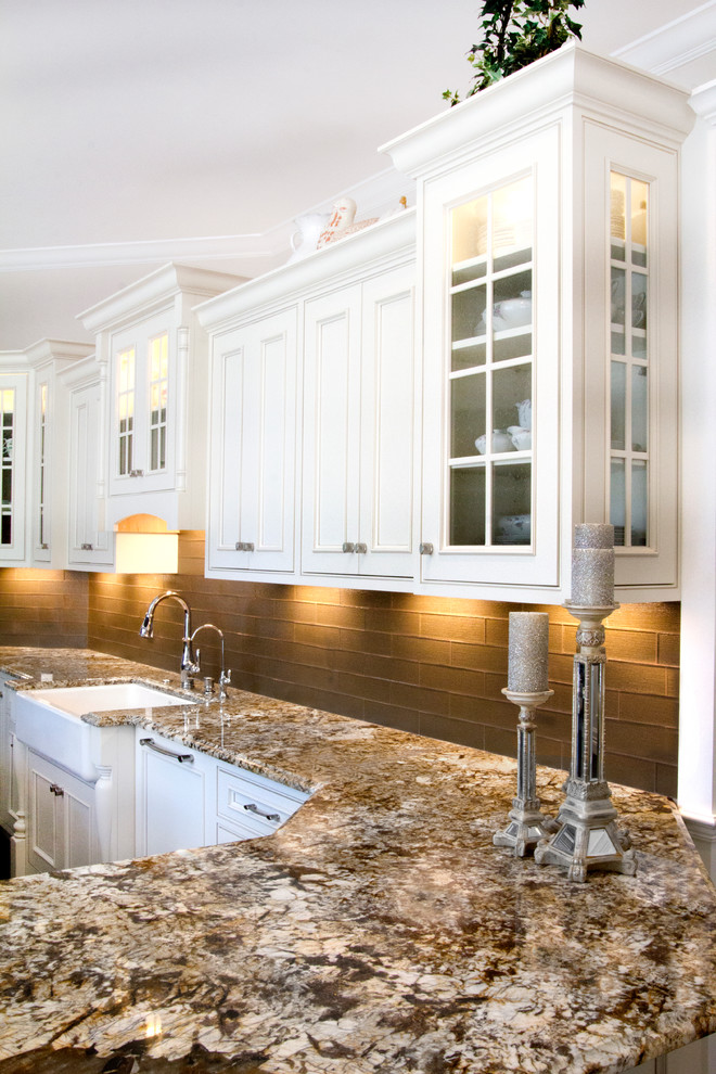 This is an example of a large traditional u-shaped open plan kitchen in Tampa with a belfast sink, beaded cabinets, white cabinets, granite worktops, grey splashback, dark hardwood flooring and an island.